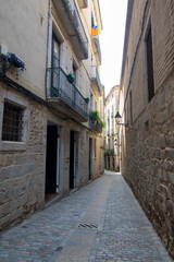 Stone alleyway in Girona's historic center