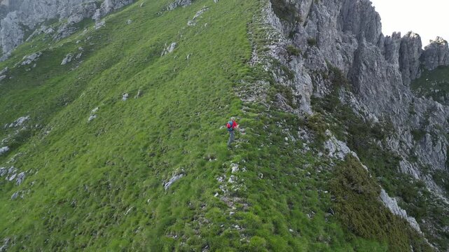 Man hiking a ridge in the Orobie Alps, Italy