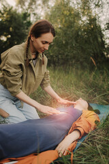 Female energy massage relaxing and care treatment for body and mind full health gentle woman arms holding head doing access bars. Unity with nature and wellness concept. Part of the series