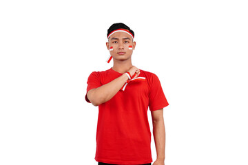 An Indonesian man giving salute to celebrate Indonesia's independence day on 17 August isolated...