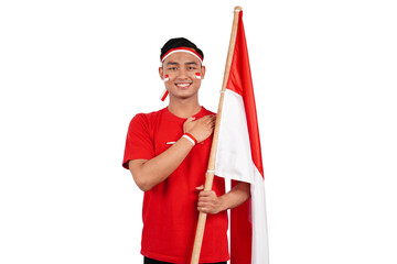 An Indonesian man giving salute to celebrate Indonesia's independence day on 17 August isolated...