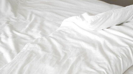 Smooth white bedsheet background, soft texture, clean and minimalist style.