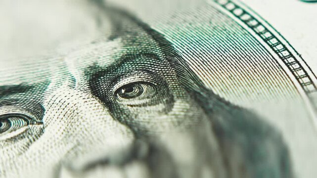 High details of the Portrait of Benjamin Franklin one One hundred dollars banknote, selective focus