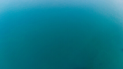 A tranquil gradient of blue hues embodies the serene essence of the ocean's depths in this soothing background