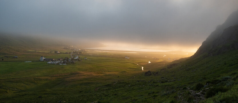 Foggy and misty valley next to Ryten mountain in the Lofoten islands during early morning