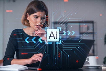 Woman working on a laptop with AI graphic overlay in a modern office setting.