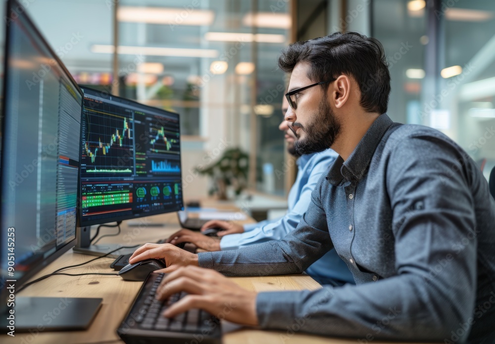 Aufkleber Financial office, two men sitting at a table holding a computer keyboard or mouse to operate a desktop artificial intelligence system that displays stock market data in green, blue and red.