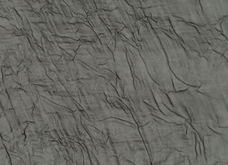 Crumpled black polyester mesh garment material background