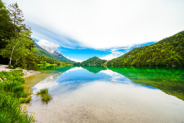 Landscape at Hintersteiner See near Scheffau in Tyrol. Idyllic nature at the mountain lake in the Wilder Kaiser nature reserve in Austria.
