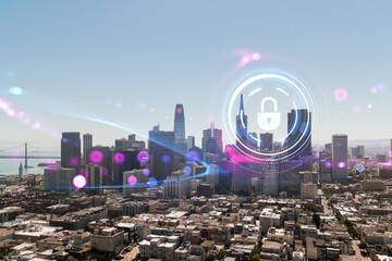 Cybersecurity concept with holographic lock over cityscape during daytime.