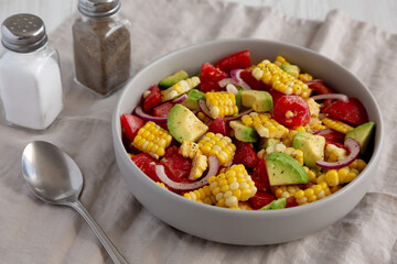 Healthy Fresh Corn Salad in a Bowl, side view.