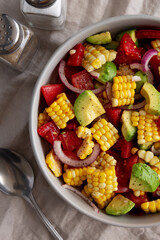 Healthy Fresh Corn Salad in a Bowl, top view. Flat lay, overhead, from above. Close-up.