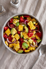Healthy Fresh Corn Salad in a Bowl, top view. Flat lay, overhead, from above.