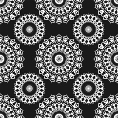 Seamless pattern with white ornament on black background. Vector illustration