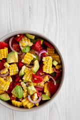Healthy Fresh Corn Salad in a Bowl, top view. Flat lay, overhead, from above. Copy space.