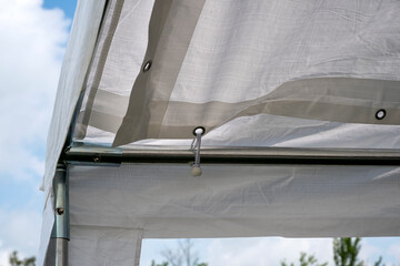 Assembling a big white tent