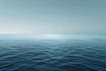 Obraz premium Calm Ocean Surface Under a Pale Blue Sky