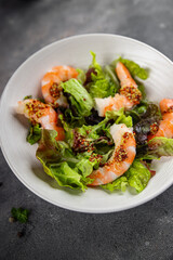 shrimp salad prawns or langoustines green leaf lettuce mix fresh meal food snack on the table copy space food background rustic top view 