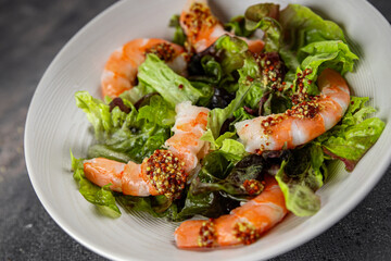 shrimp salad prawns or langoustines green leaf lettuce mix fresh meal food snack on the table copy space food background rustic top view 