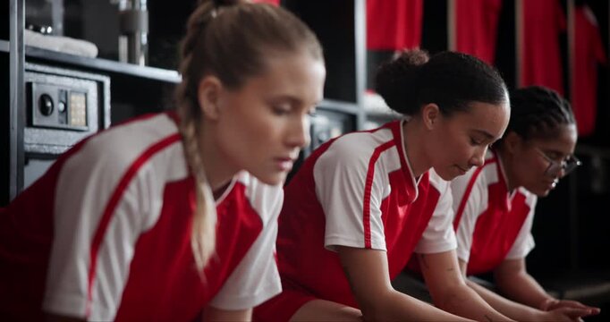 Group, athlete and thinking of soccer, sports and teammates with anxiety for match in locker room. Football player, women and nervous of competition, contemplating and scared of results of game