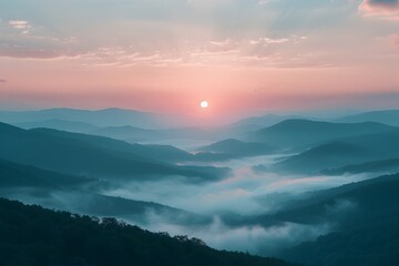 Fototapeta premium the serene beauty of sunrise over mist-covered mountains with soft pastel colors. sunrise over misty mountains, beautiful nature and wild landscape
