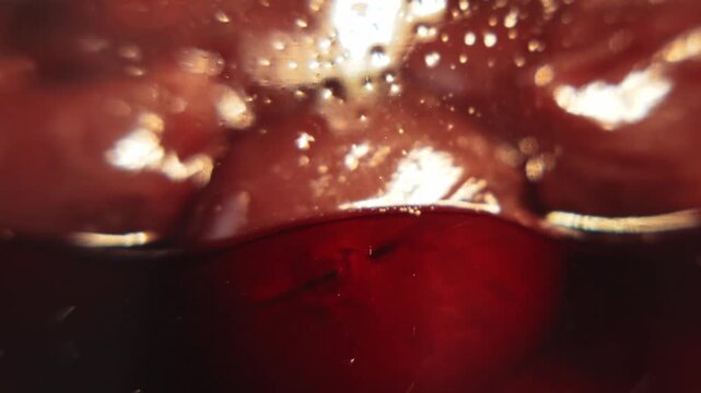 Ripe sour cherries in a glass jar, macro view