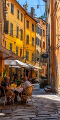 Obraz premium Two Men Sitting at a Table on a Cobblestone Street in Italy