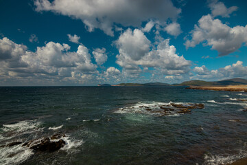 Rocky vulcanic beaches and high mountains of Sardinia island, Italy