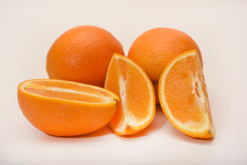Oranges on a white background. Chopped fruits.