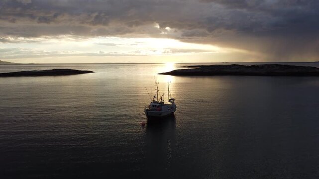 Fishing boat aerial view during the midnight sun in Northern Norway near Bod&oslash;