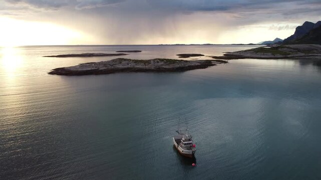 Fishing boat aerial view during the midnight sun in Northern Norway near Bod&oslash;