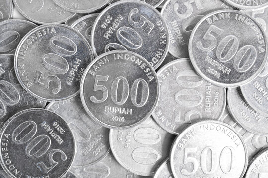 Stack of 500 rupiah coins on white background. National currency. Indonesian rupiah coin. Top view