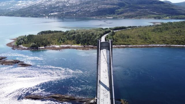 Aerial drone top view of bridge in Northen Norway with cars driving on top 
