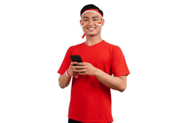 An Indonesian man celebrating Indonesia's independence day on 17 August while holding smartphone with blank screen isolated transparent