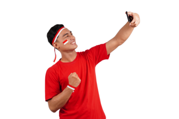 An Indonesian man celebrating Indonesia's independence day on 17 August while holding smartphone with blank screen isolated transparent
