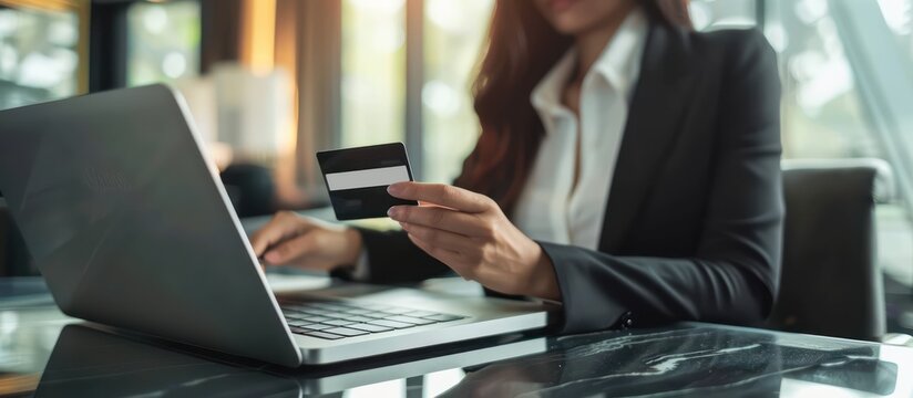 Businesswoman making online payment with credit card for e-commerce, internet banking, online shopping. Concept of secure financial transactions, digital banking, and modern lifestyle.