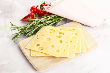 Sliced maasdam cheese with holes