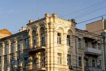 Fototapeta premium street ancient houses a old windows and balconies Soviet architecture pastel colors of painted houses architectural stucco