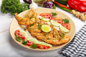 Grilled prawn served lime and vegetables