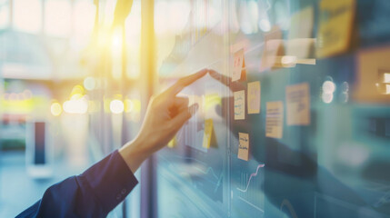 A hand engages with an illuminated digital whiteboard filled with sticky notes, suggesting a collaborative brainstorming session in a modern workspace.