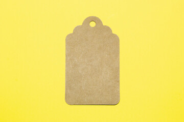 Cardboard Label in Yellow Background, Simplicity Design. Shopping Concept.