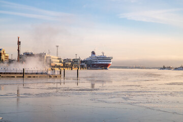 helsinki seaside promenade on a cold icy winter day in helsinki finland with sunset in the...