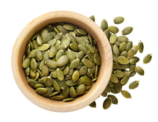 Pumpkin seeds in a wooden plate cut out on a white. Top view
