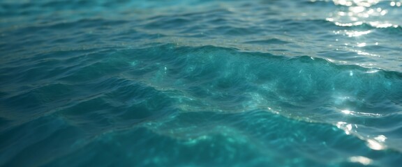 Beautiful turquoise blue ocean water surface with light reflections and highlights Texture of water close-up macro.