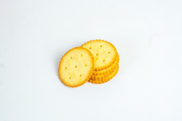 A stack of delicious wheat round yellow biscuits with isolated background