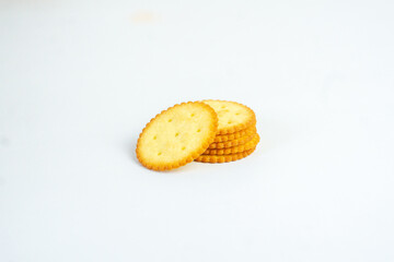 A stack of delicious wheat round yellow biscuits with isolated background