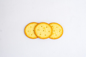 A stack of delicious wheat round yellow biscuits with isolated background