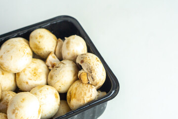 Fresh shiitake mushroom in box on isolated white background