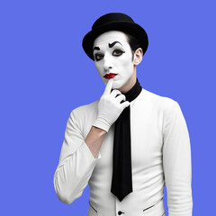 Portrait of french mime on blue background.