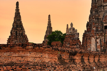 Phra Nakhon Si Ayutthaya District, Wat Chaiwatthanaram, Thailand, July 07, 2024, Ancient Buddhas at Sunset in Ayutthaya.